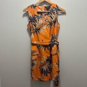 Papillon floral romper with faux pockets and buttons